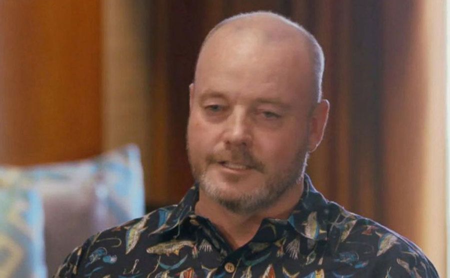 John speaks during an interview.