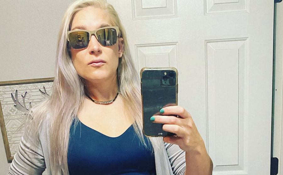 Megan Lowder takes a picture of herself in front of a mirror.