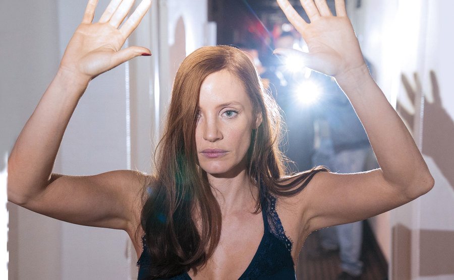 Chastain, as Molly Bloom, gets arrested.