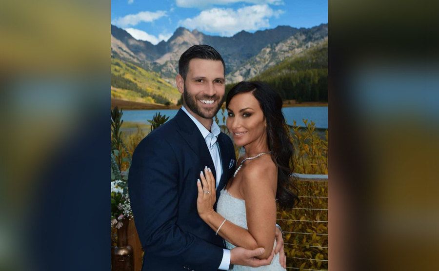 Molly poses with her husband.