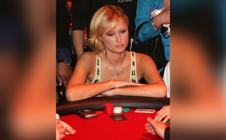 Paris Hilton plays poker.