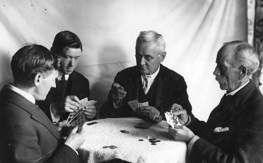 A group of men playing a game of poker.