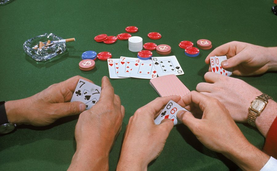 View of three hands in a game of Texas Hold 'Em.