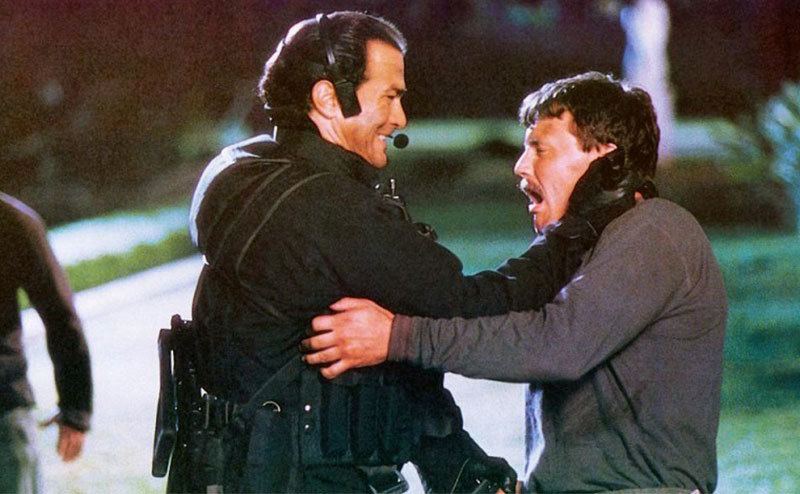 Seagal grabs Leguizamo’s neck in a still from the film.