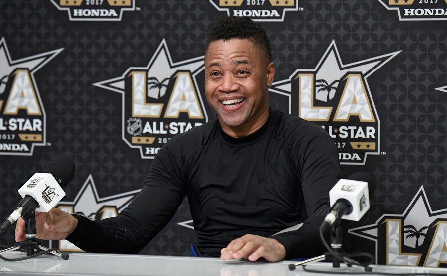Gooding Jr. speaks with the media.