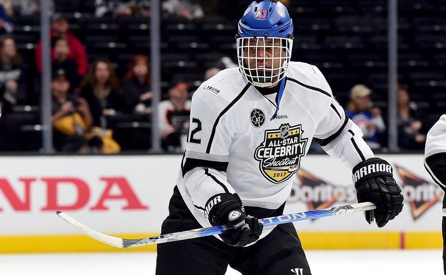 An image of Gooding Jr. playing hockey.