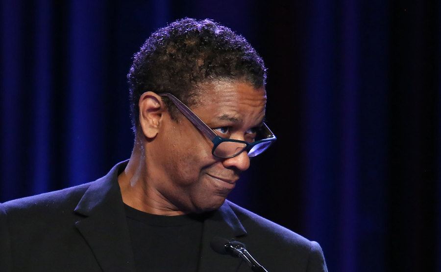 Washington speaks on stage.