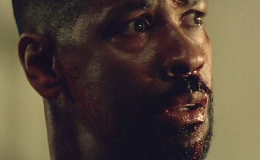 A still of Washington in a scene from the film.