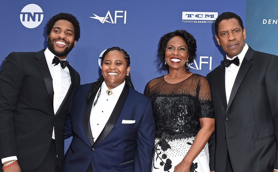 Malcolm Washington, Katia Washington, Pauletta Washington, and Denzel Washington attend an event.