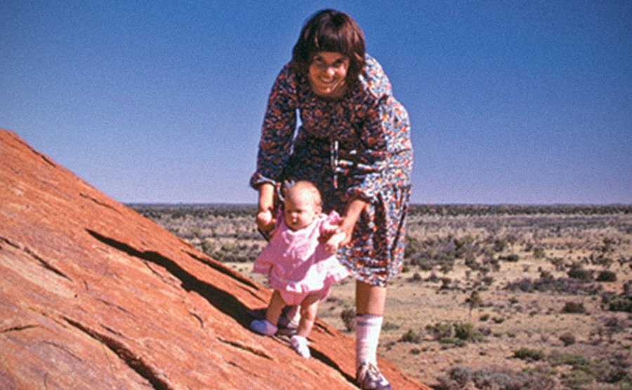 A dated photo of Lindy with Azaria in a deserted landscape.