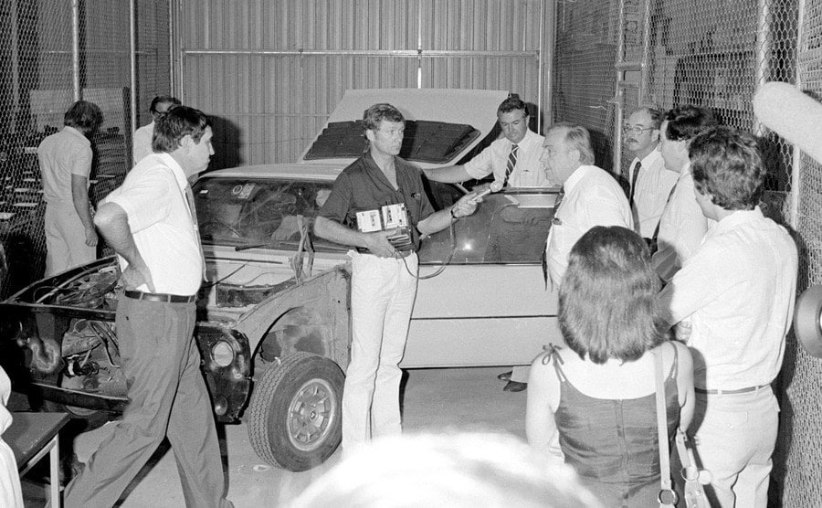 Lindy and Michael’s car is examined inside the police compound.
