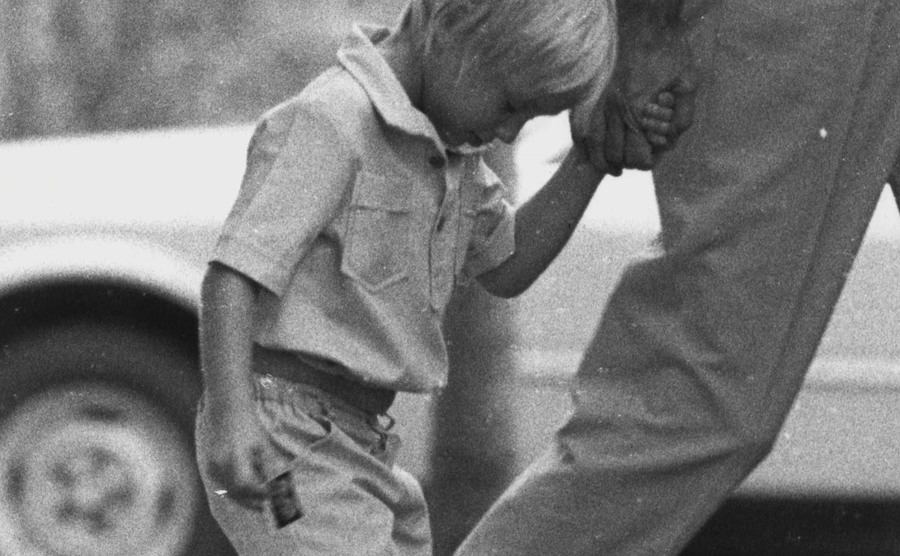 Reagan Chamberlain walks away from photographers on his way to church.