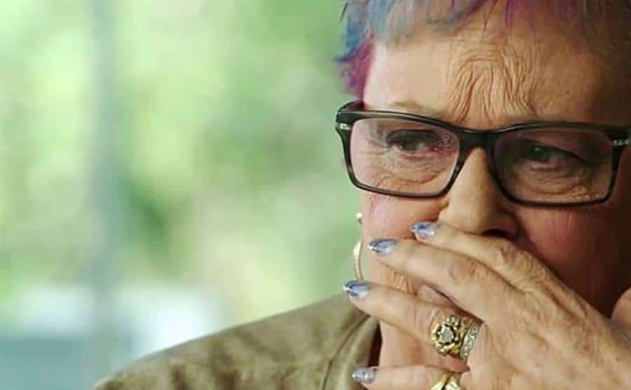 A video still of Lindy breaking down in tears.