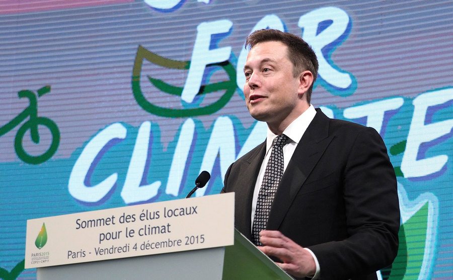A photo of Elon Musk during a conference.