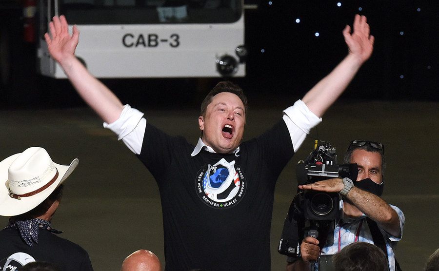 A photo of Elon Musk celebrating the successful launch of a Falcon 9 rocket.