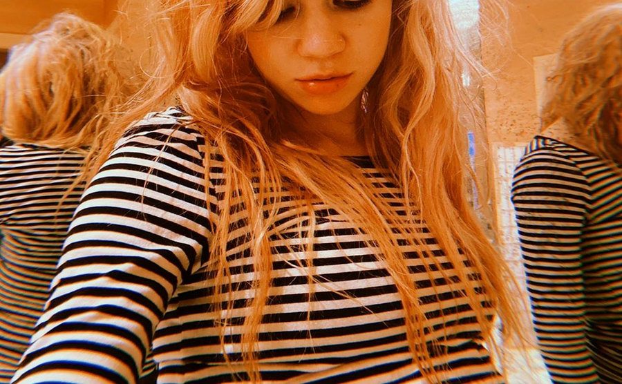 Grimes takes a picture of herself during the pregnancy.