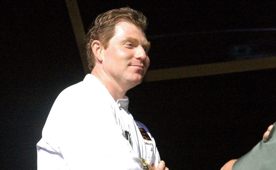 An image of Bobby Flay during a cooking demonstration.