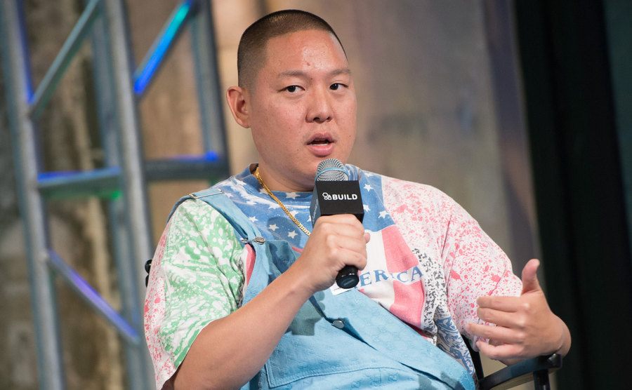 Eddie Huang speaks at a microphone.