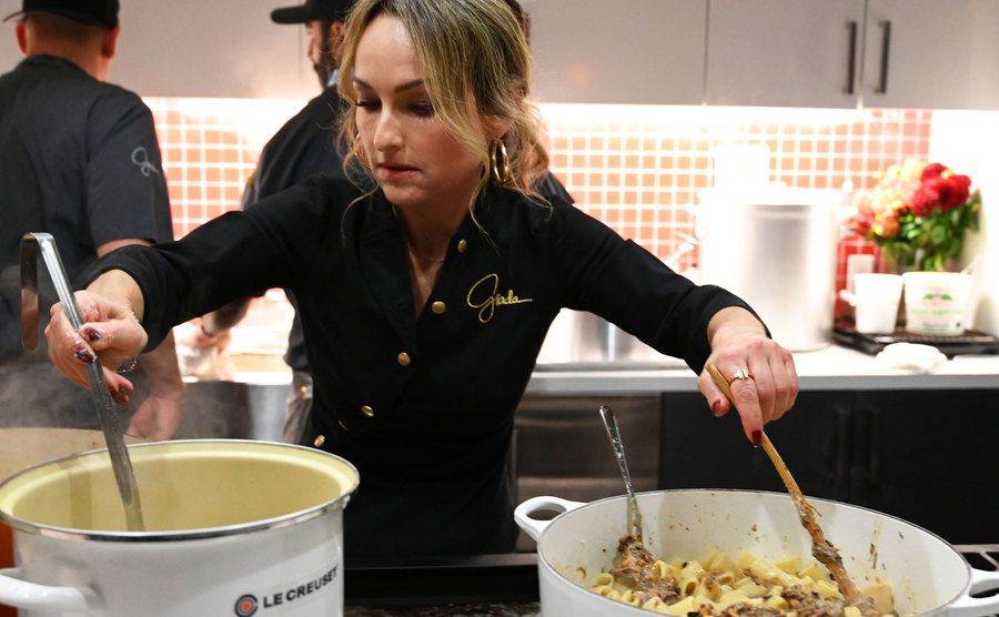 A photo of Giada De Laurentiis cooking.