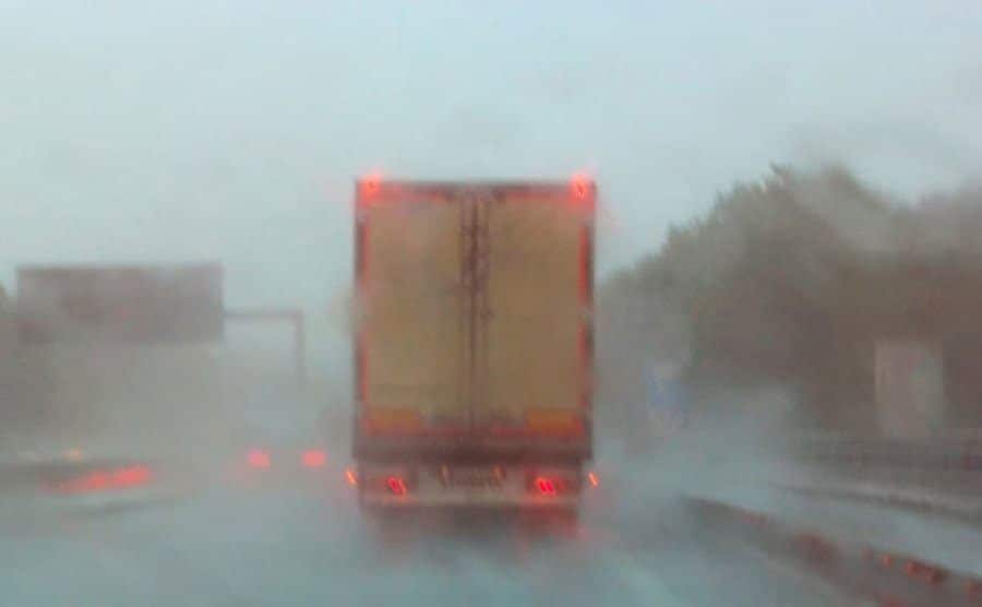 An image of Coquihalla Highway on a rainy and snowy day.