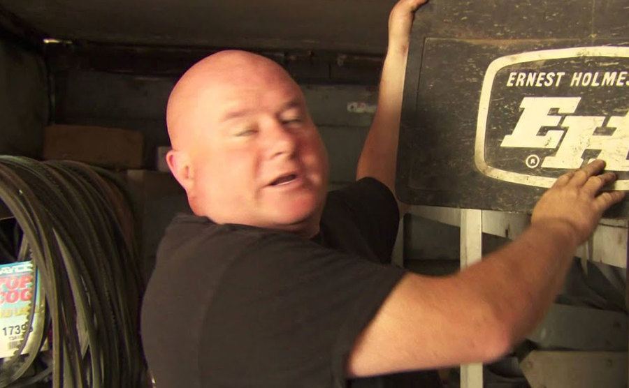 A video still of Jamie Davis in his garage.