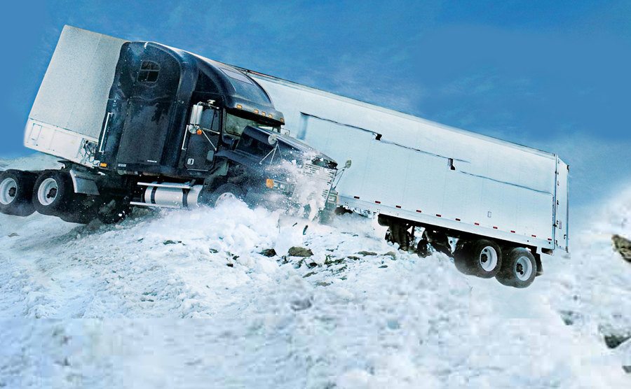 A still from a truck accident in the snow in Ice Road Truckers.