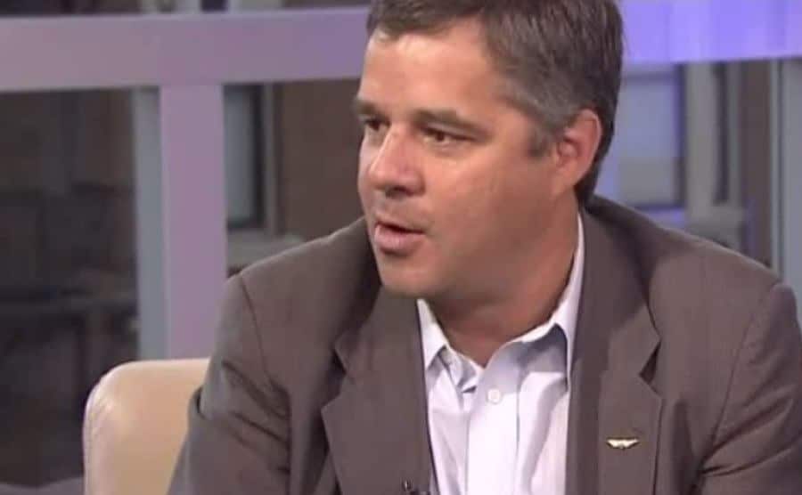 A still of Mark Miller during a televised interview.