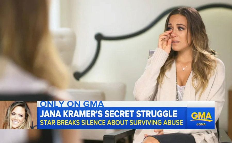 Jana Kramer breaks down during an interview.
