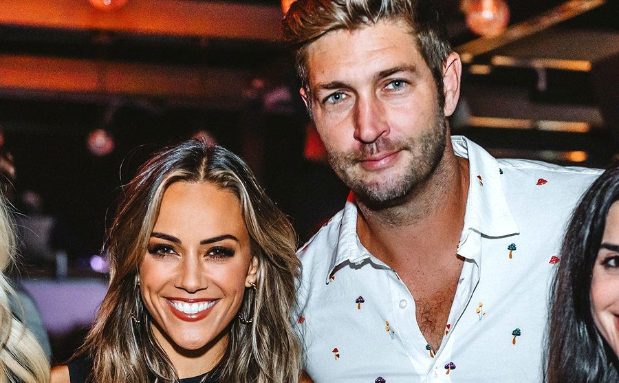 Jana Kramer and Jay Cutler pose together at a party.