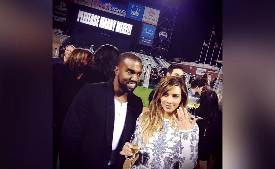 Kim shows off her ring right after the engagement.