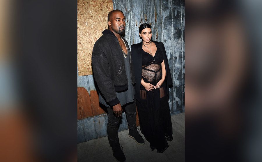 Kanye West and Kim Kardashian attend the Givenchy fashion show.