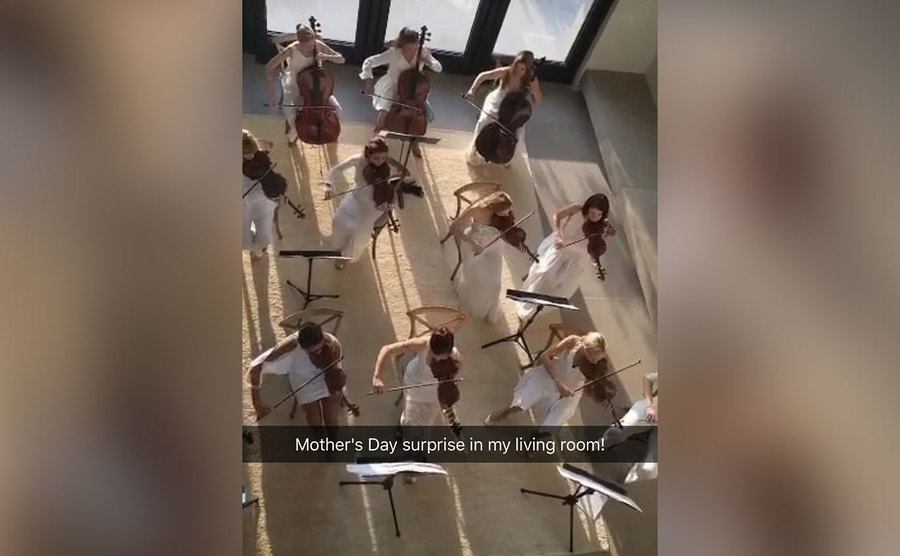 An orchestra performs in the Kardashian-West living room.