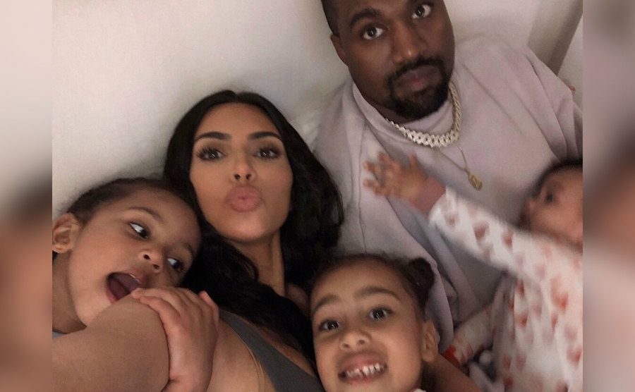 A selfie of Kim, Kanye and their kids at home.