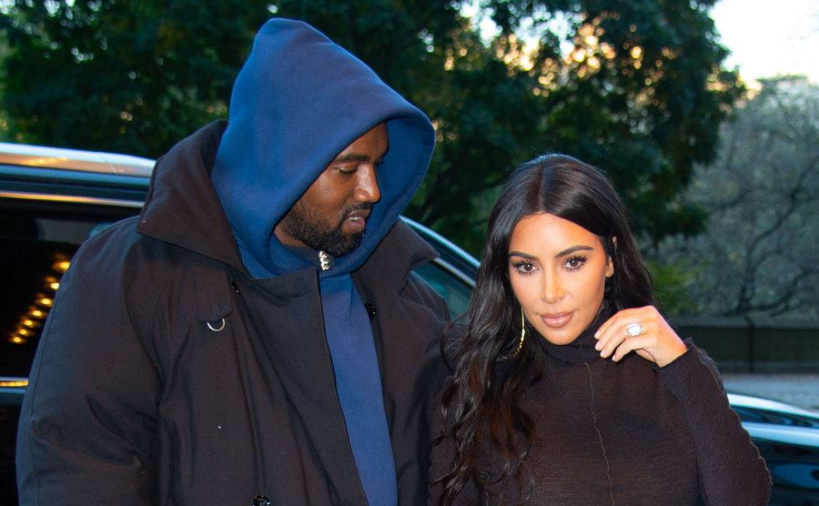 Kanye West and Kim Kardashian return to their hotel.
