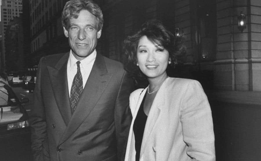 A photo of Povich and Connie Chung walking the street.