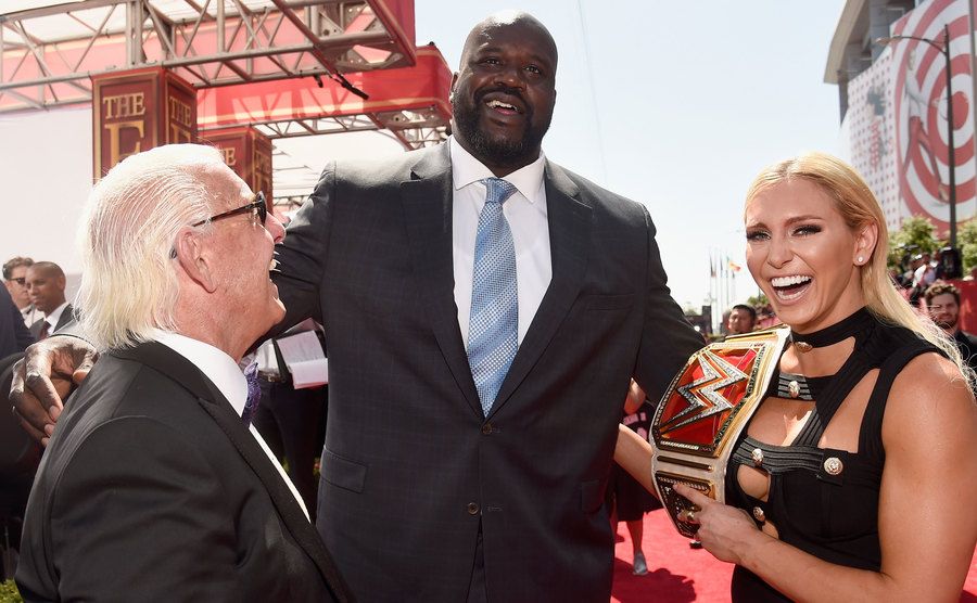 A picture of O’Neal greeting Ric Flair and Charlotte.