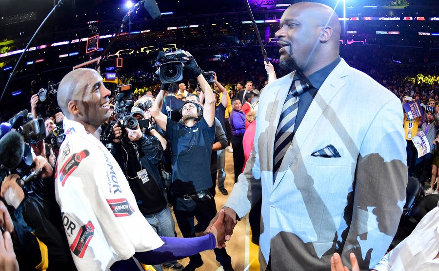 Bryant talks with former teammate O'Neal after a game.