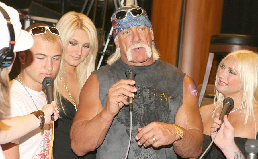 A photo of the Hogan family talking to the media.