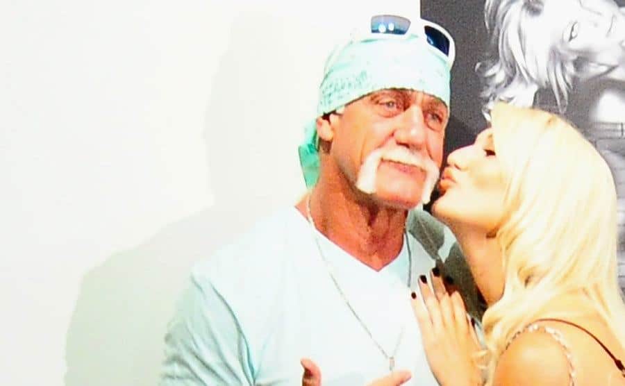 Brooke kisses her father on the cheek.