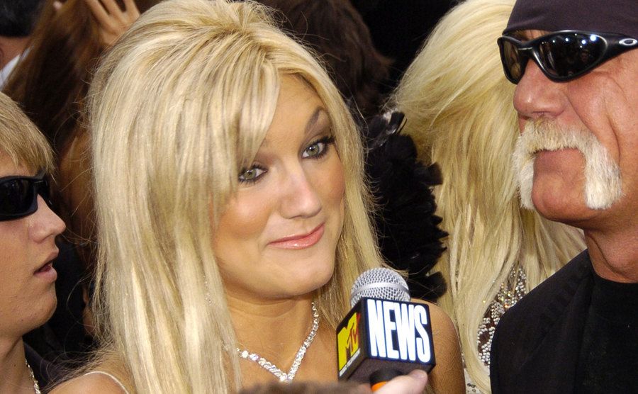 A photo of Brooke addressing the media.