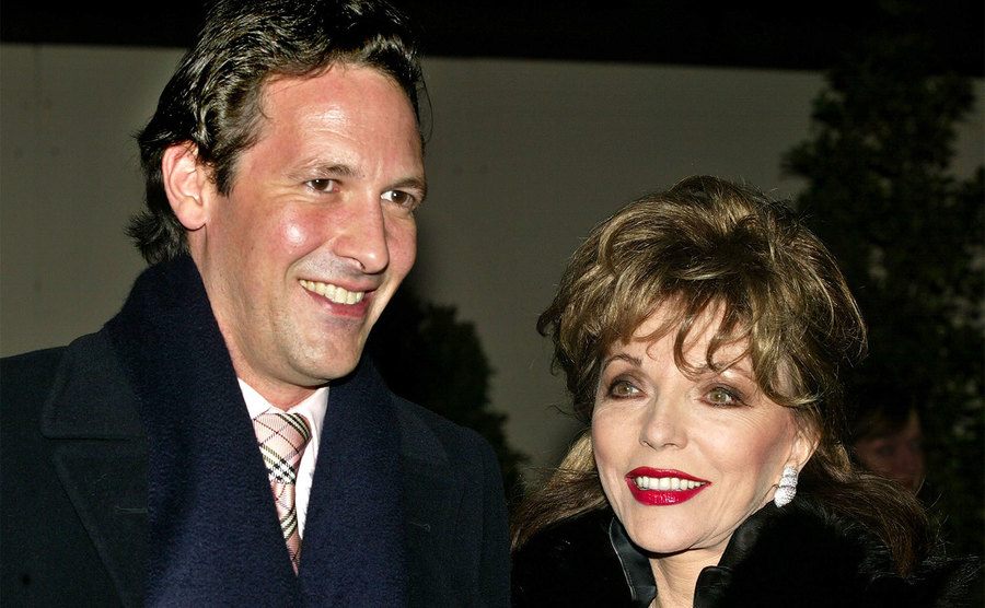 Joan Collins and Percy Gibson pose for a photograph.