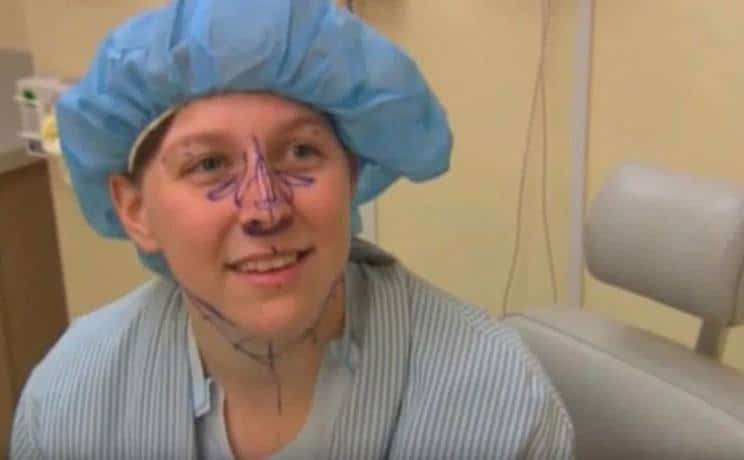 A contestant sits in a hospital room before surgery.