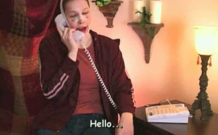 A contestant post-surgery is talking on the phone.