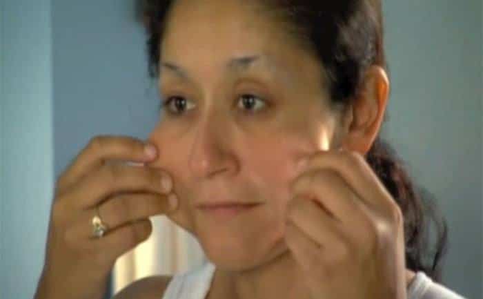 A contestant checks out her face.