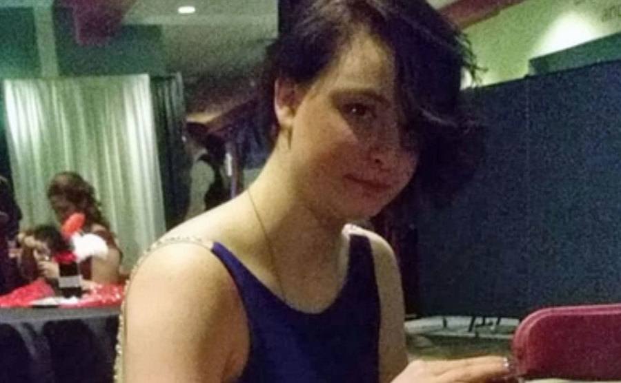 A photo of Denali Brehmer sitting in a restaurant.