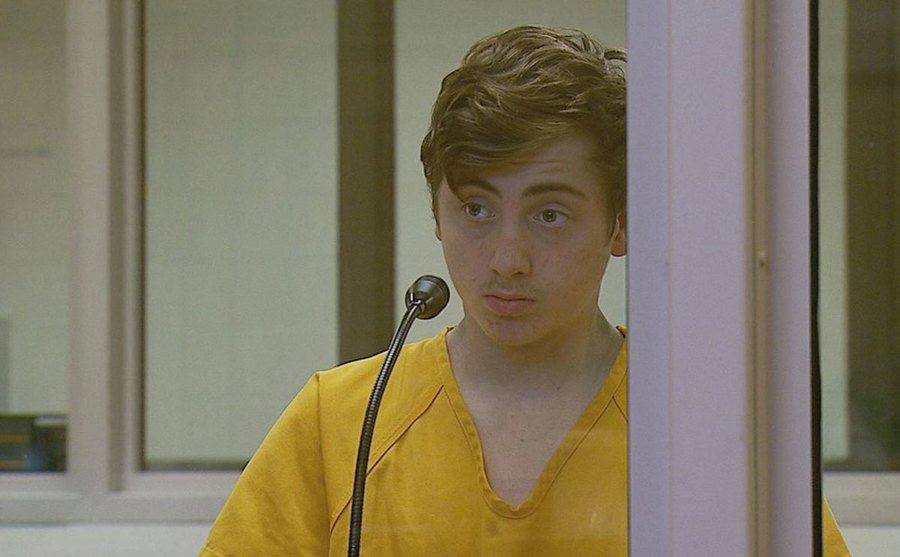 Kayden McIntosh stands in court.