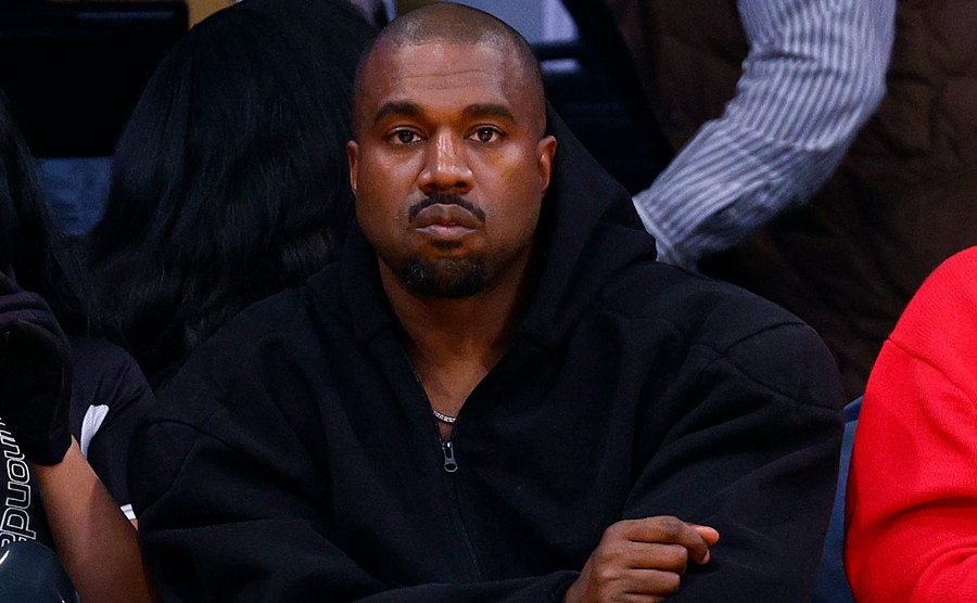 A portrait of Kanye West during a basketball game.