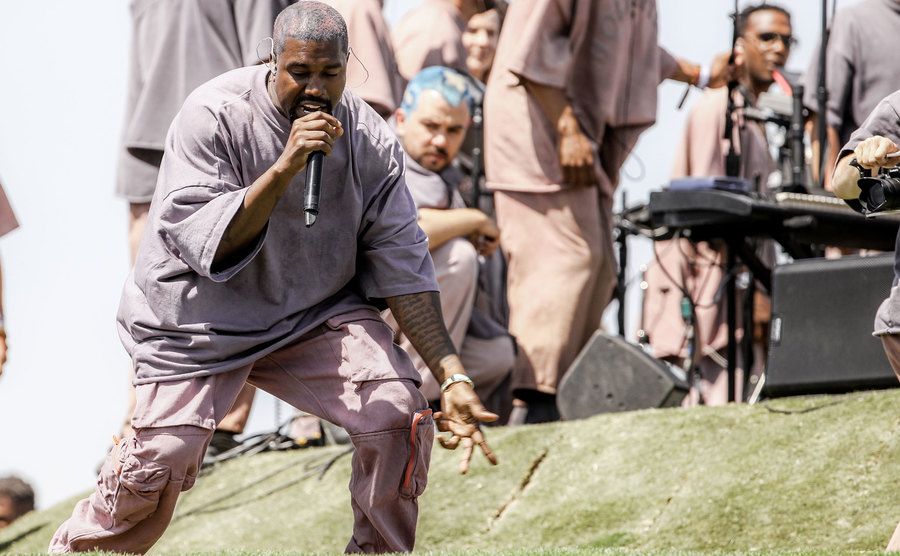 An image of Kanye West performing on stage.