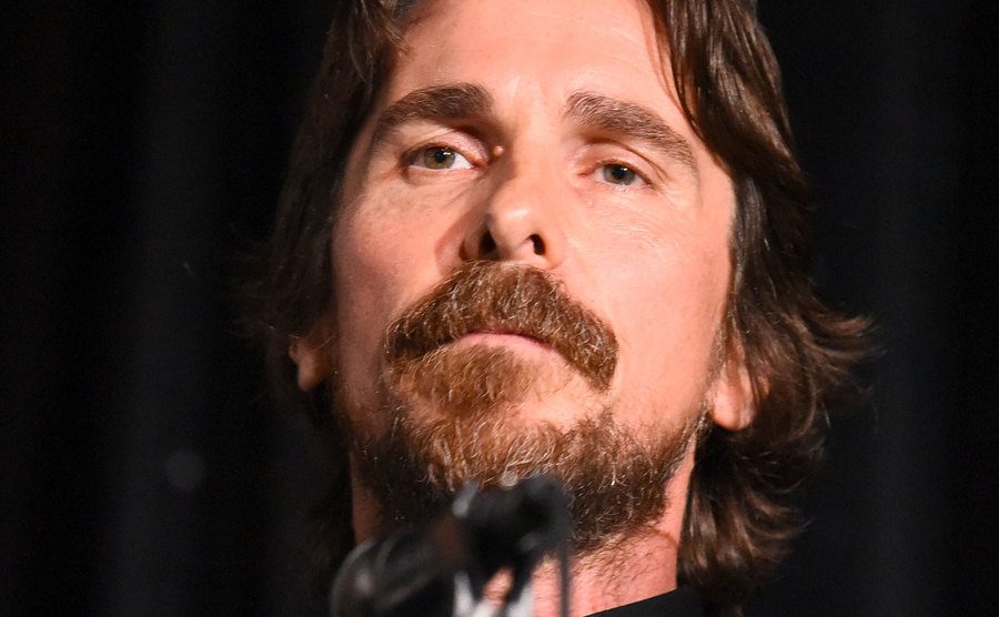 Christian Bale speaks on stage.