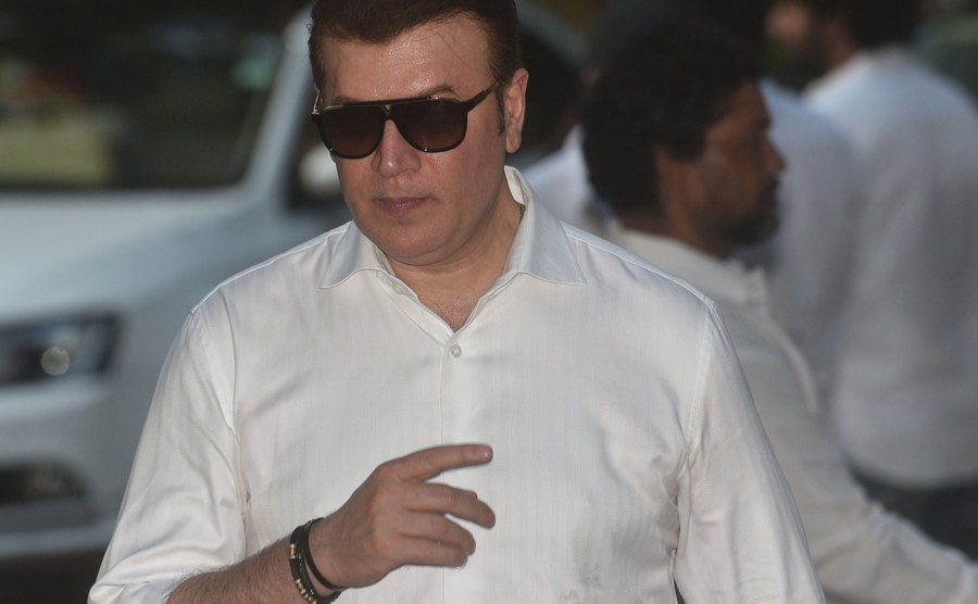 Aditya Pancholi walks the street.